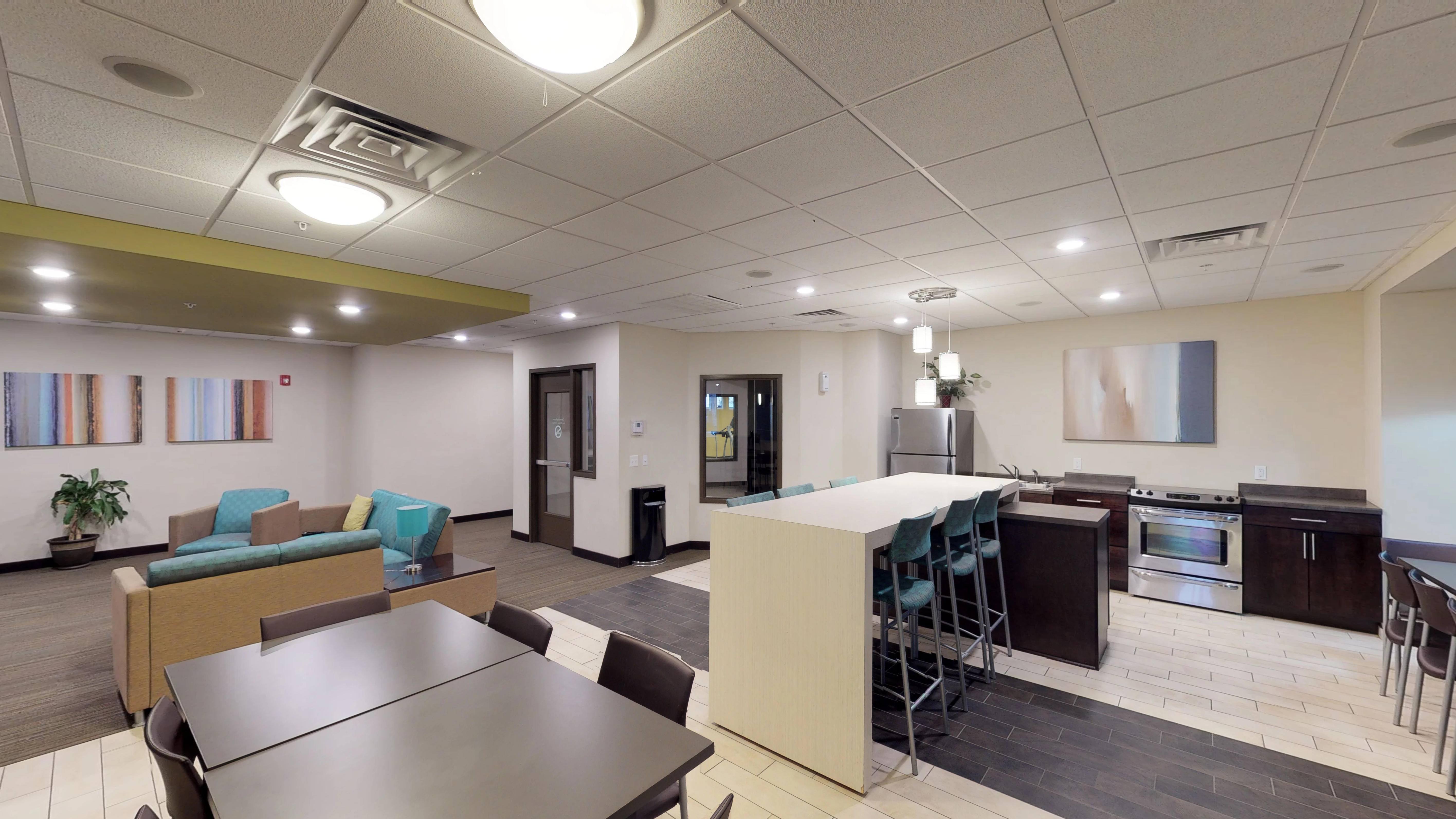 A modern kitchen and dining area in a commercial space.